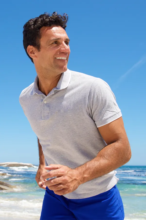 EMSculpt-Arm-Sculpting-Treatment A man running on the beach. Schedule EMSculpt® Arm Sculpting from Healthy Aging Medical Centers of New Jersey in Northern New Jersey.