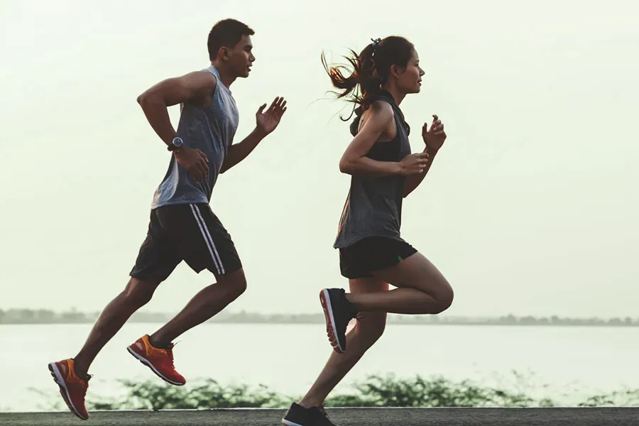 GLP-1-Weight-Loss-Injections-Clinic A couple in profile running along the water. Schedule GLP-1 Weight Loss Injections from Healthy Aging Medical Centers of New Jersey in Northern New Jersey.