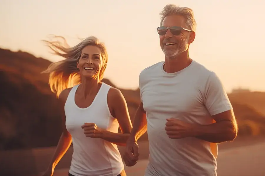 Styku-Body-Scanner-Clinic A middle-age couple happily jogging at sundown. Get a Styku Body Scan from Healthy Aging Medical Centers of New Jersey in Northern New Jersey.